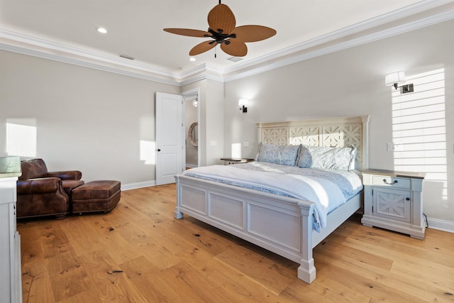 bedroom featuring ceiling fan, ornamental molding, and light hardwood / wood-style floors