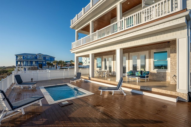 view of swimming pool featuring a wooden deck and an outdoor hangout area