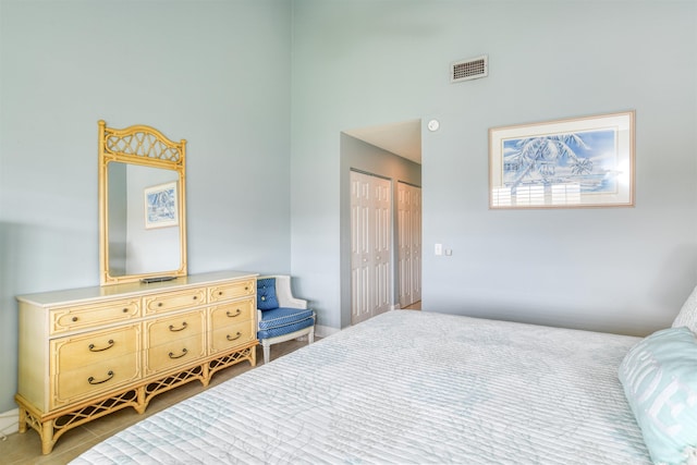 bedroom featuring a closet and light tile patterned floors