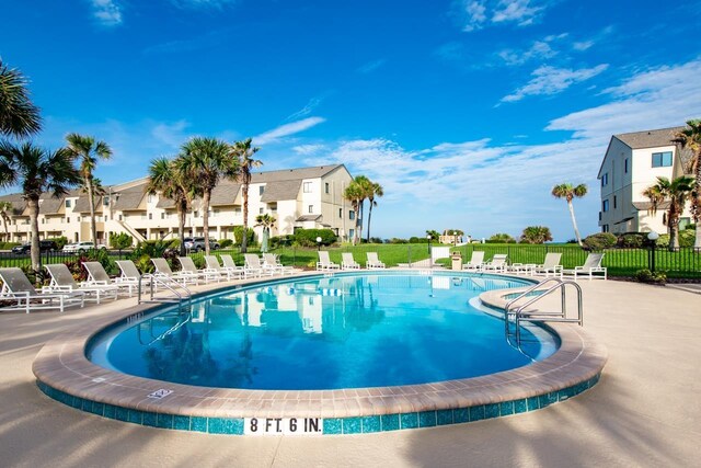 view of swimming pool with a patio area