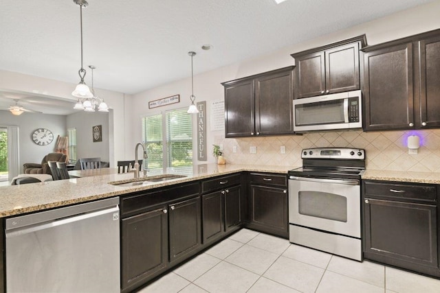 117 Mission Cove Cir, Saint Augustine, FL 32084 - kitchen with appliances with stainless steel finishes, a sink, healthy amount of natural light, and backsplash