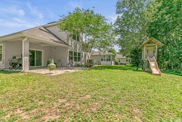 117 Mission Cove Cir, Saint Augustine, FL 32084 - view of grassy yard featuring a patio, ceiling fan, and a playground