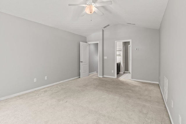117 Mission Cove Cir, Saint Augustine, FL 32084 - unfurnished bedroom featuring lofted ceiling, light carpet, baseboards, and ceiling fan