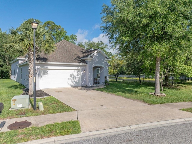 117 Mission Cove Cir, Saint Augustine, FL 32084 - view of front facade with an attached garage, stucco siding, driveway, and a shingled roof