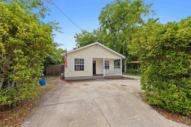461 S Nassau St, Saint Augustine, FL 32084 - bungalow-style house featuring covered porch, fence, and concrete driveway