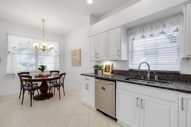 kitchen with dishwasher, a healthy amount of sunlight, white cabinetry, and sink