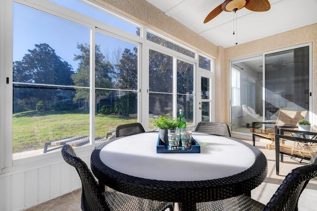 sunroom / solarium with ceiling fan