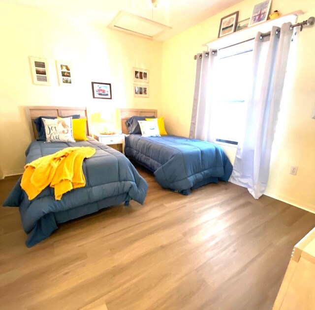 bedroom with light wood-type flooring