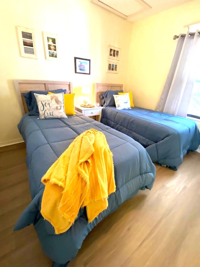 bedroom with wood-type flooring