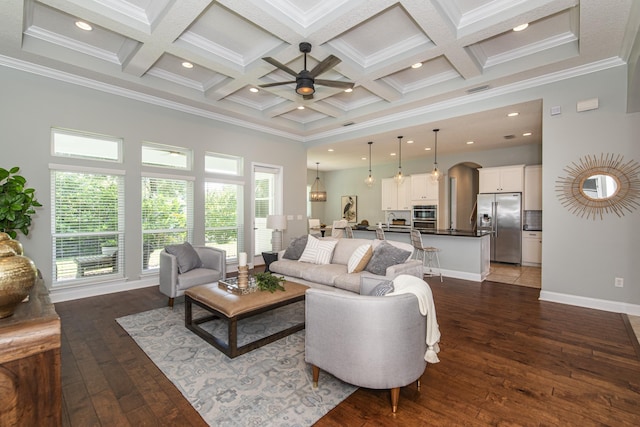 living room with beamed ceiling, dark wood-type flooring, coffered ceiling, and ornamental molding