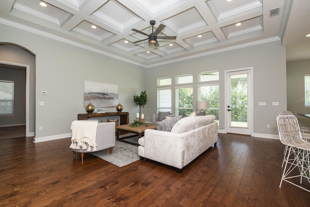 living room featuring dark hardwood / wood-style floors, ornamental molding, and coffered ceiling