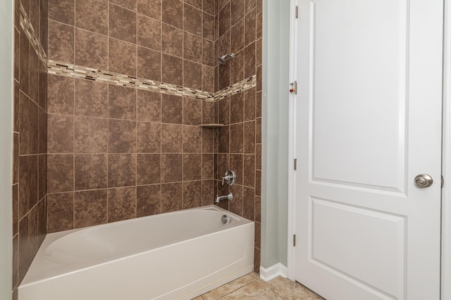 bathroom featuring tile patterned flooring and tiled shower / bath combo