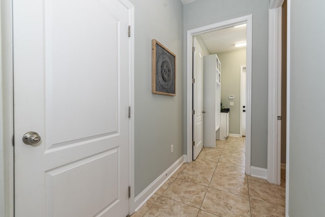 corridor featuring light tile patterned flooring