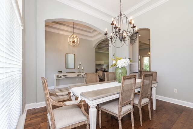 dining room featuring a tray ceiling, crown molding, dark hardwood / wood-style floors, and a notable chandelier