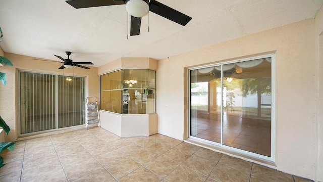 view of patio / terrace featuring ceiling fan