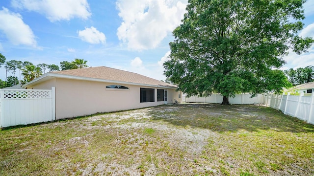 view of yard with a fenced backyard