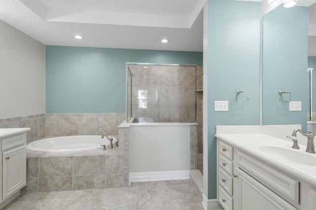 bathroom featuring tile patterned flooring, a walk in shower, recessed lighting, a bath, and vanity