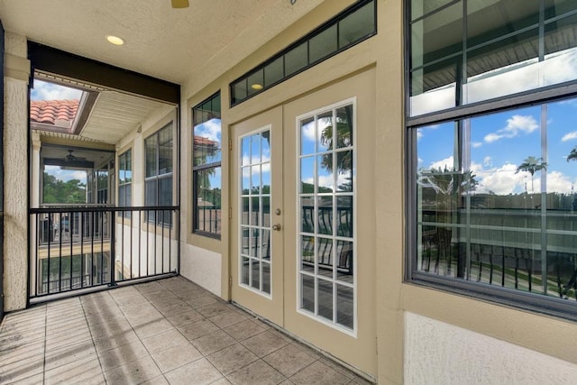 unfurnished sunroom with french doors