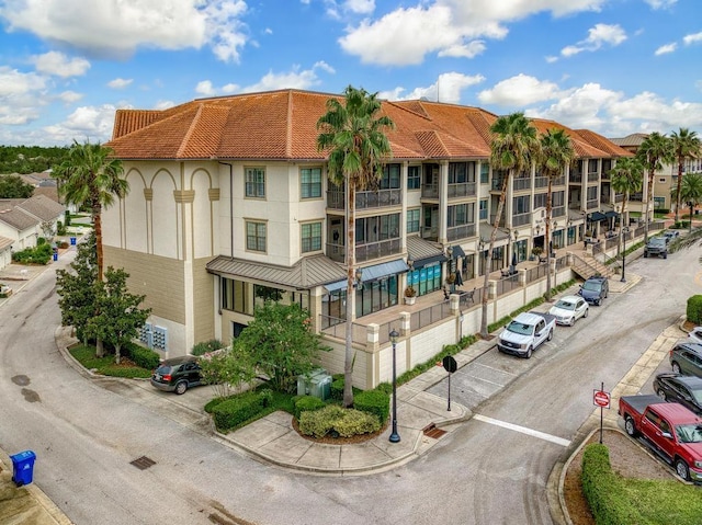 view of property featuring uncovered parking