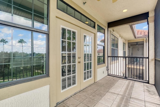 unfurnished sunroom featuring french doors