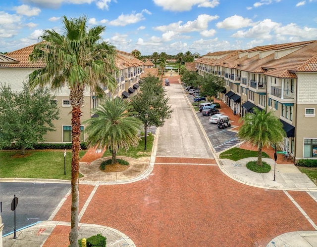 exterior space featuring uncovered parking and a residential view