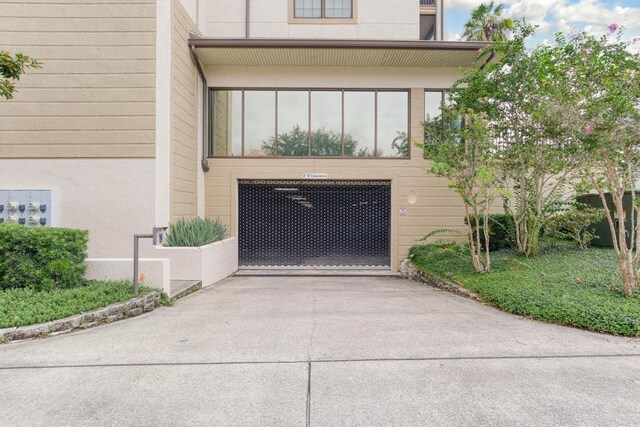 701 Market St Unit 304, Saint Augustine, FL 32095 - view of front facade featuring driveway and an attached garage