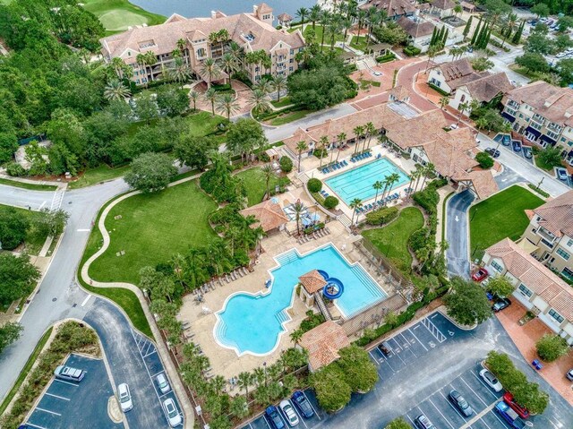 birds eye view of property with a residential view