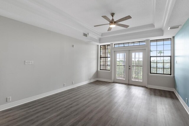 701 Market St Unit 304, Saint Augustine, FL 32095 - spare room featuring a raised ceiling, ceiling fan, dark wood-type flooring, french doors, and baseboards
