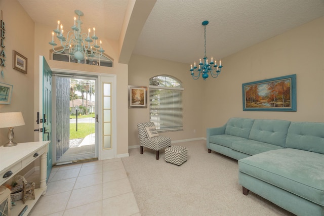 984 Windward Way, Saint Augustine, FL 32080 - living area with a chandelier, a textured ceiling, light carpet, and light tile patterned floors