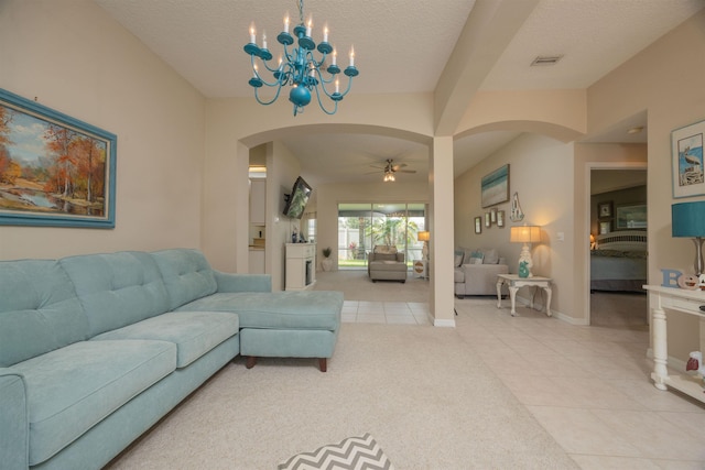 984 Windward Way, Saint Augustine, FL 32080 - living area with arched walkways, light tile patterned flooring, ceiling fan, a chandelier, and a textured ceiling