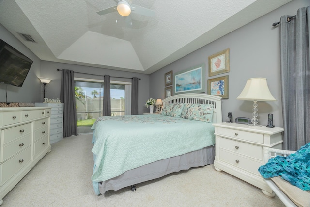 984 Windward Way, Saint Augustine, FL 32080 - bedroom with light carpet, access to exterior, a textured ceiling, a ceiling fan, and lofted ceiling