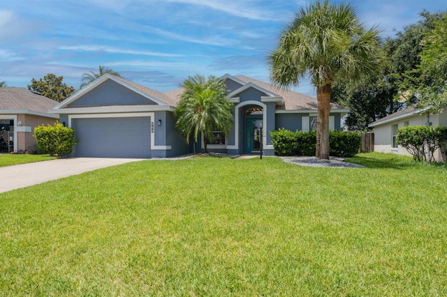 984 Windward Way, Saint Augustine, FL 32080 - ranch-style house with concrete driveway, a garage, a front lawn, and stucco siding