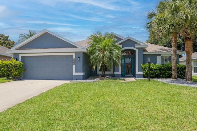 984 Windward Way, Saint Augustine, FL 32080 - ranch-style house featuring stucco siding, a front yard, concrete driveway, and a garage