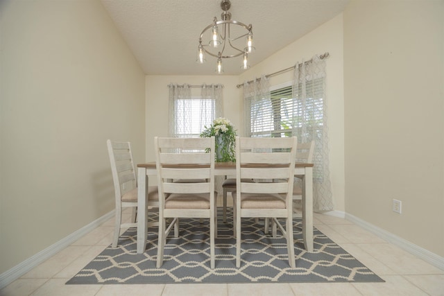 984 Windward Way, Saint Augustine, FL 32080 - tiled dining area with a chandelier and a textured ceiling