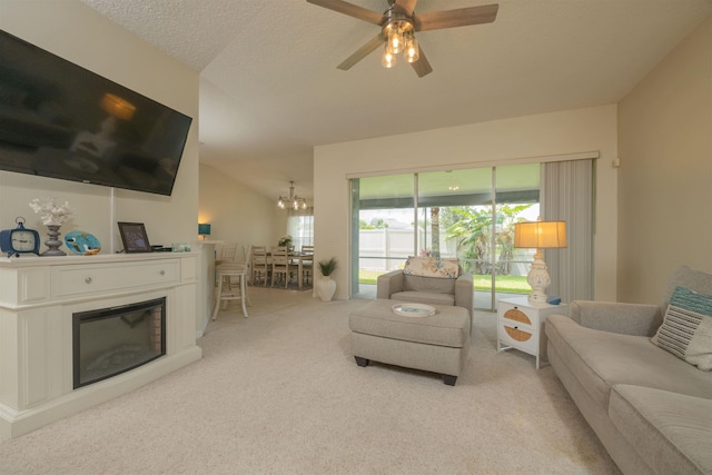 984 Windward Way, Saint Augustine, FL 32080 - living area with carpet flooring, a glass covered fireplace, and a ceiling fan