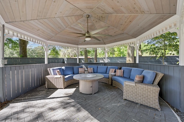 view of patio featuring a gazebo, an outdoor living space, and ceiling fan