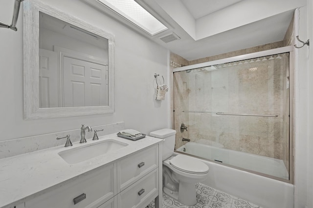 full bathroom with toilet, vanity, and combined bath / shower with glass door