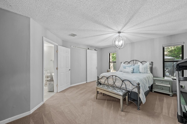 carpeted bedroom featuring a chandelier, a textured ceiling, and multiple windows