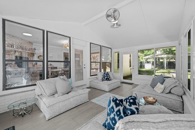 sunroom featuring vaulted ceiling with beams