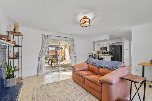 living room featuring light tile patterned floors and a textured ceiling