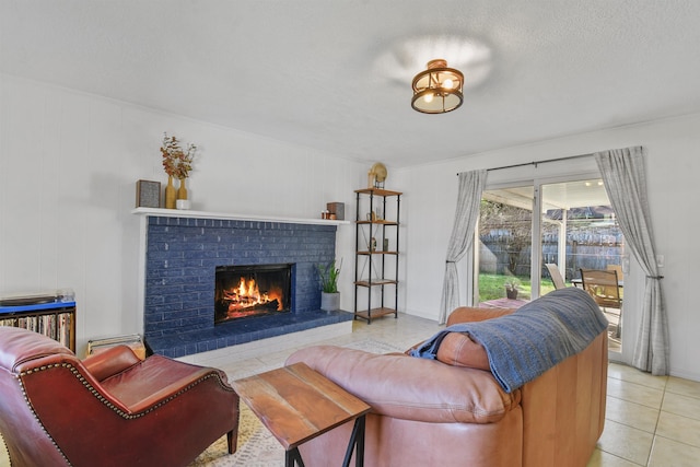 living room with light tile patterned floors, a brick fireplace, and a textured ceiling