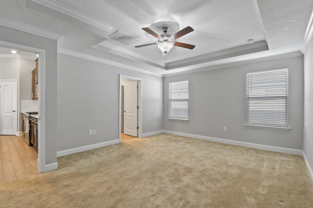 181 Narvarez Ave, Saint Augustine, FL 32084 - unfurnished bedroom with light colored carpet, baseboards, crown molding, and a raised ceiling