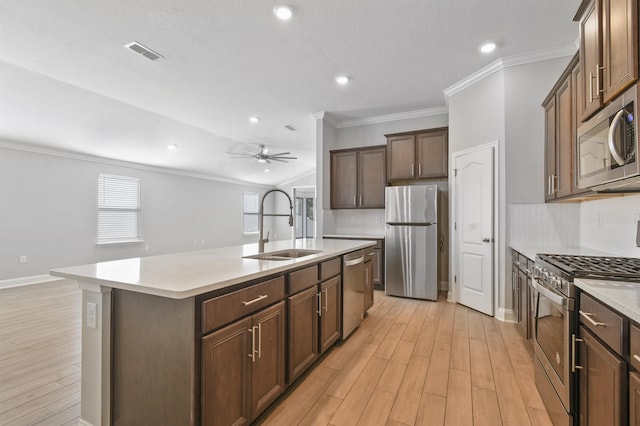 181 Narvarez Ave, Saint Augustine, FL 32084 - kitchen with a sink, visible vents, appliances with stainless steel finishes, an island with sink, and ornamental molding