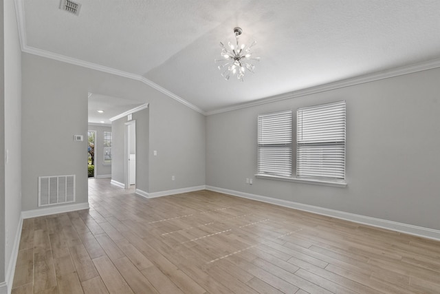 181 Narvarez Ave, Saint Augustine, FL 32084 - empty room featuring light wood-type flooring, visible vents, crown molding, and a notable chandelier