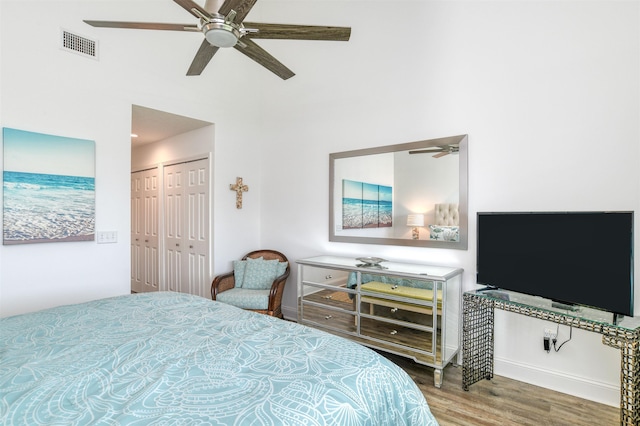 bedroom with hardwood / wood-style flooring and ceiling fan