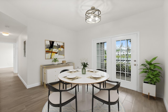 dining area with dark hardwood / wood-style floors