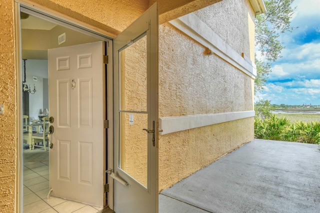 2202 Vista Cove Rd, Saint Augustine, FL 32084 - property entrance with stucco siding and a patio