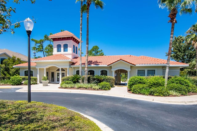 2202 Vista Cove Rd, Saint Augustine, FL 32084 - view of front of property with stucco siding, a tile roof, and french doors
