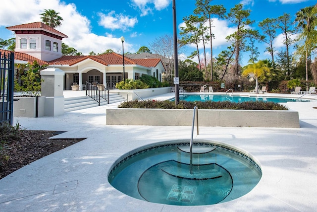 2202 Vista Cove Rd, Saint Augustine, FL 32084 - community pool featuring a community hot tub, fence, and a patio
