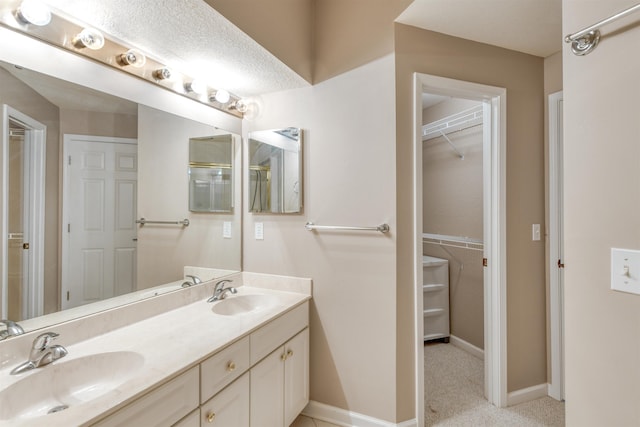 2202 Vista Cove Rd, Saint Augustine, FL 32084 - full bath with double vanity, baseboards, and a spacious closet